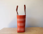 Orange and white handwoven Mexican tote bag — side view showing woven texture — Alma Rosa, Tangerine — MexiMexi