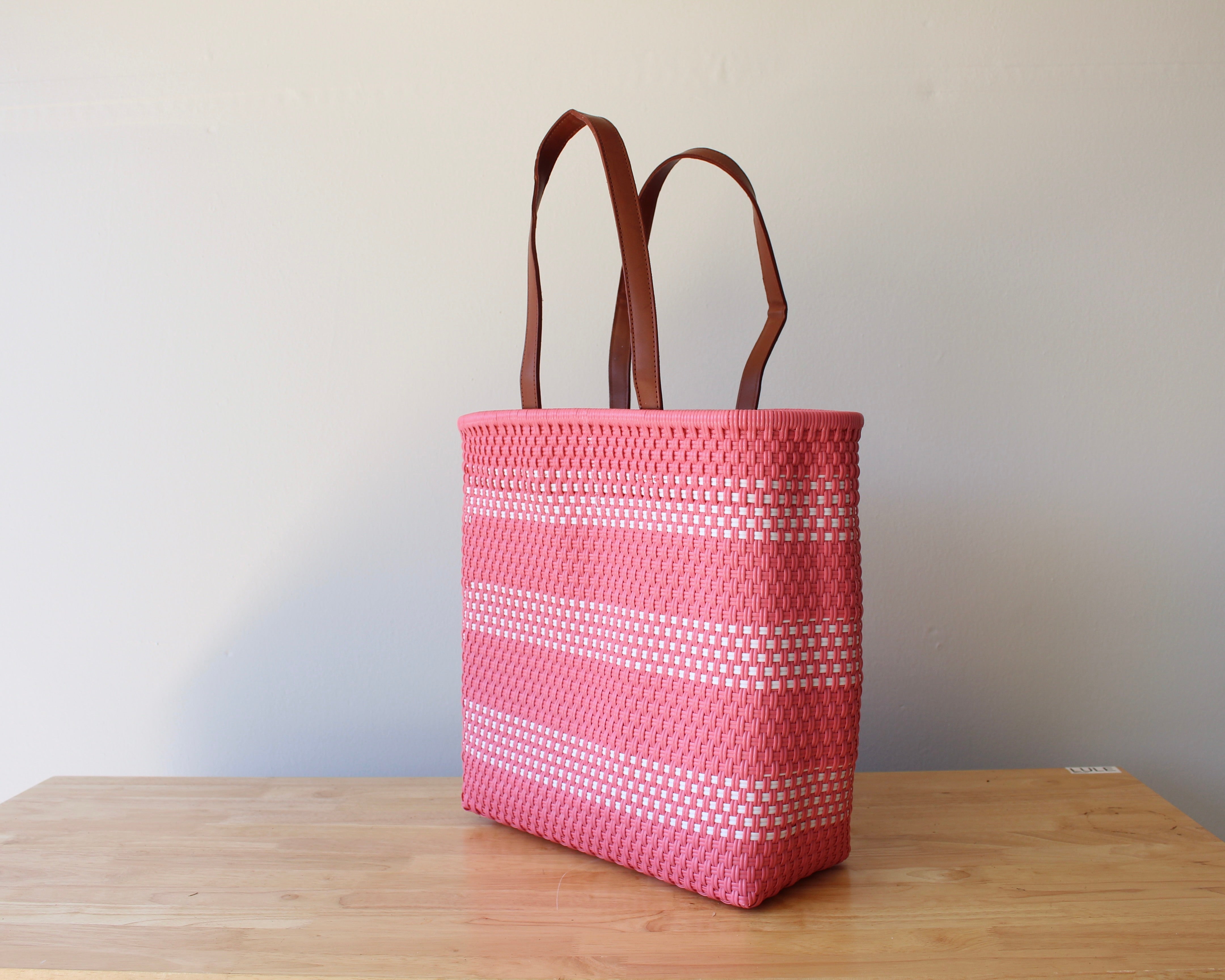 Peach Pink and white handwoven Mexican tote bag with leather handles — angled view — Alma Rosa, Blossom — MexiMexi