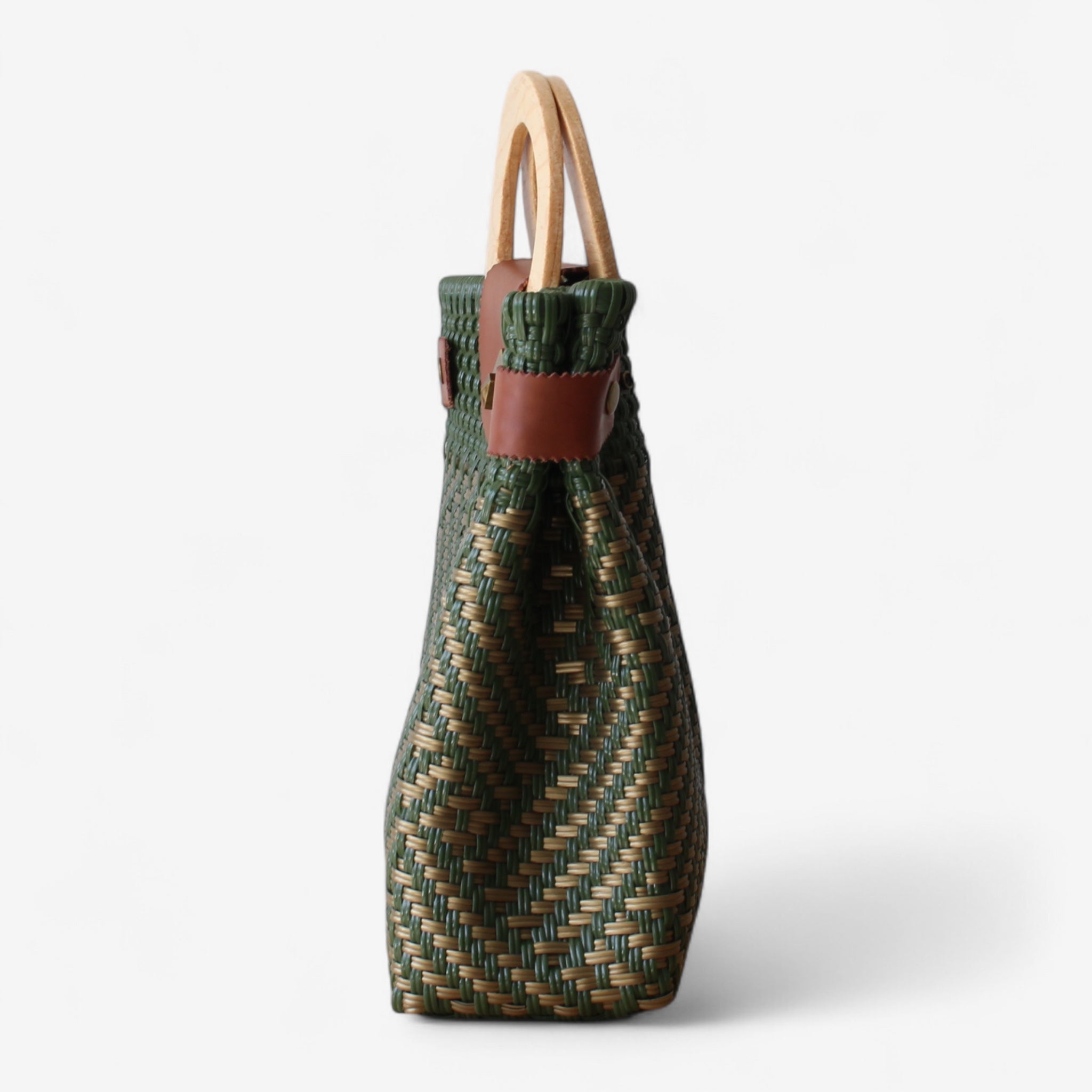 Handmade green purse with geometric weaving and wooden handle.