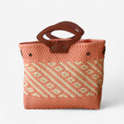 Unique coral and cream tote bag, handmade from woven plastic with genuine leather details