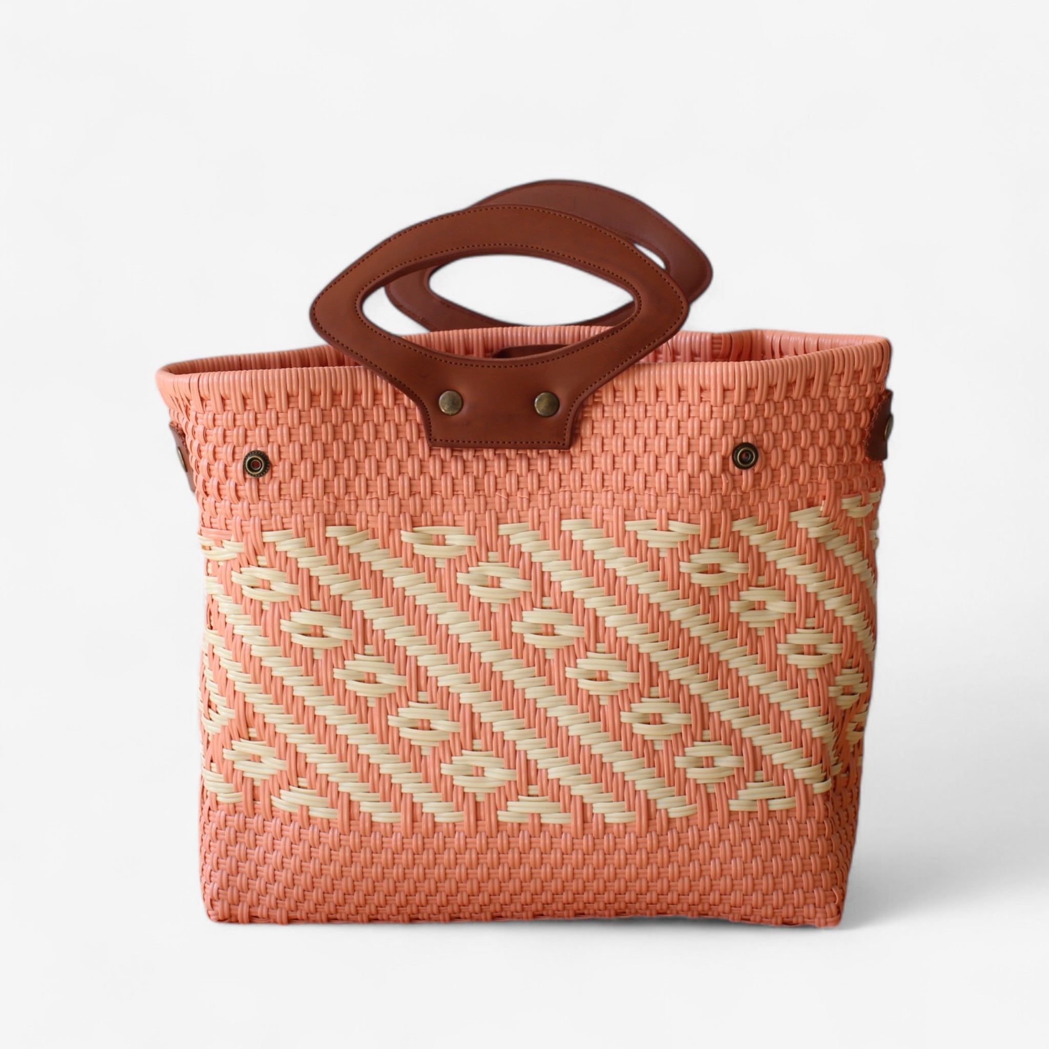 Unique coral and cream tote bag, handmade from woven plastic with genuine leather details