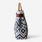Eco-friendly handmade tote bag with wooden round handles.