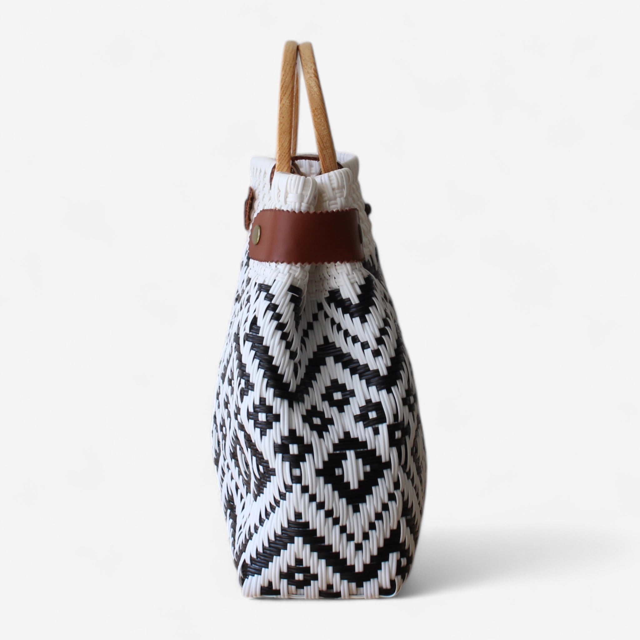 Eco-friendly handmade tote bag with wooden round handles.