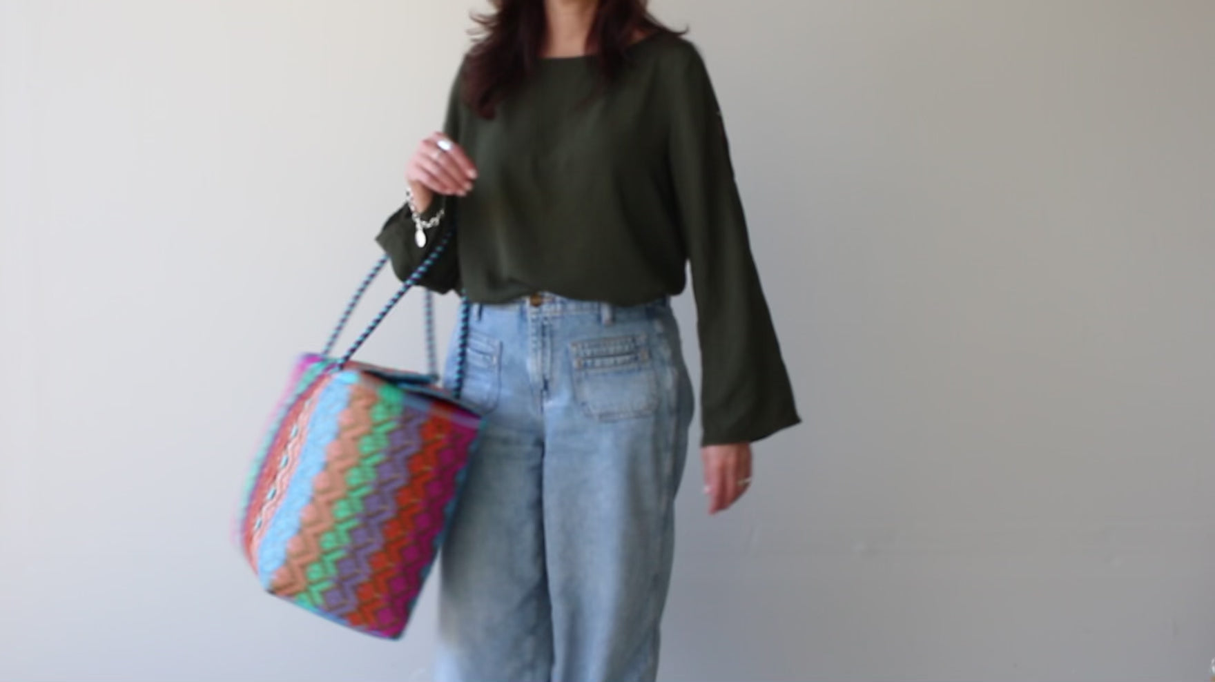 Woman carrying a Woven Plastic Bag